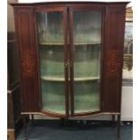 A good inlaid mahogany glass cabinet on four taper