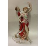 A Royal Dux figure of two dancers entwined in re