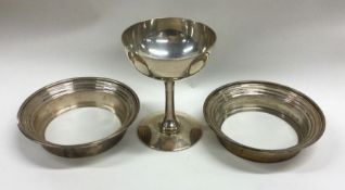 A small champagne goblet together with two dish mo