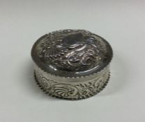 A chased silver and embossed box with lift-off cov