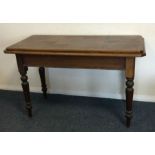 A large rectangular mahogany occasional table. Est