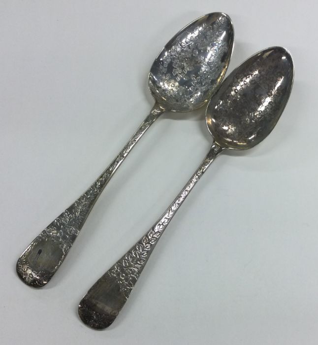 A pair of Georgian bright cut silver tablespoons.