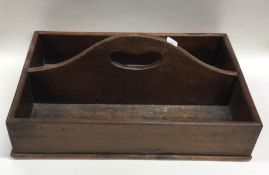 A Georgian mahogany cutlery tray with central hand