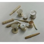 A selection of ivory and other bobbins and thread
