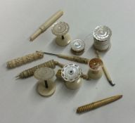 A selection of ivory and other bobbins and thread