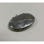 A small oval silver hinged top compact. Est. £20 -