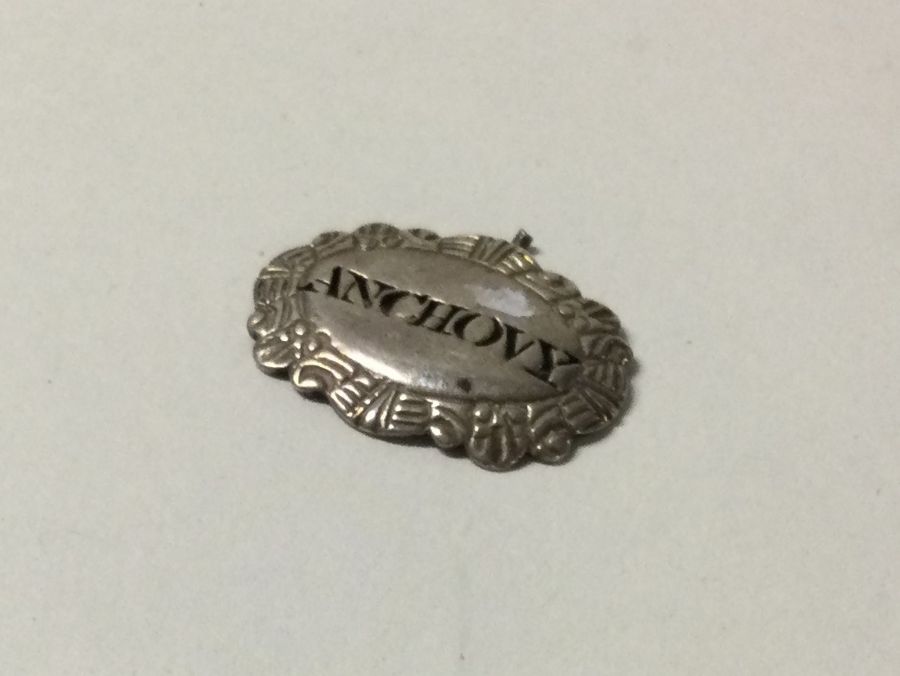 A Georgian silver wine label for 'Anchovy'. London