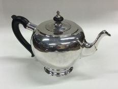 A heavy Russian silver bullet shaped teapot of pla