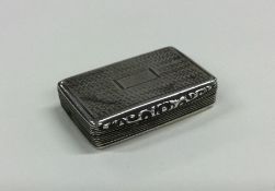 A rectangular engine turned silver snuff box with