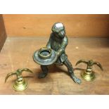 An unusual bronze figure in the form of a monkey