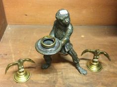 An unusual bronze figure in the form of a monkey