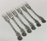 A set of six Continental silver forks with floral