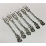 A set of six Continental silver forks with floral