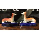 A matched pair of Staffordshire dogs in seated pos