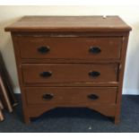 A pine three drawer chest. Est. £25 - £35.