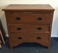 A pine three drawer chest. Est. £25 - £35.