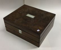 A rosewood and MOP hinged top jewellery box. Est.