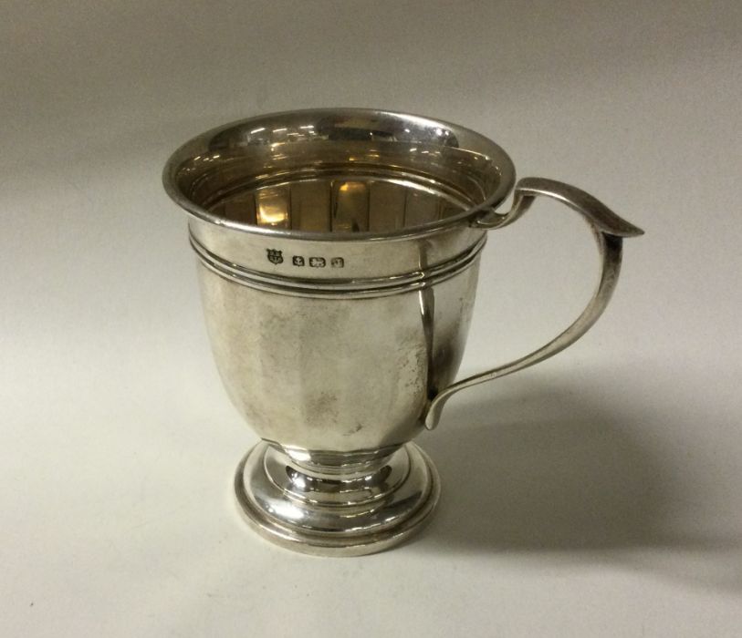 An Edwardian silver panelled christening cup. Shef
