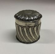 A chased silver half fluted box and cover. London