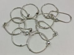 A heavy set of ten silver mesh link bracelets. App