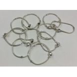 A heavy set of ten silver mesh link bracelets. App