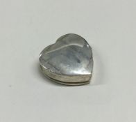 A silver heart shaped pill box with hinged lid. Ap