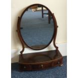 A Victorian bow front three drawer toilet mirror.