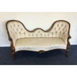 A Victorian button back chaise longue of typical f