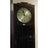 An Art Deco oak grandfather clock. Est. £30 - £50.