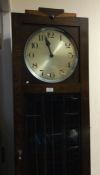 An Art Deco oak grandfather clock. Est. £30 - £50.