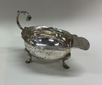 A George III silver sauce boat with card cut rim.