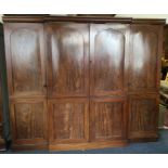 A Georgian mahogany four drawer wardrobe on pedest