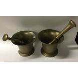 Two brass pestle and mortar sets. Est. £20 - £30.