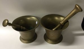 Two brass pestle and mortar sets. Est. £20 - £30.