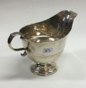 An 18th Century Georgian silver sauceboat with cre