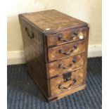 A parquetry four drawer miniature chest. Est. £20