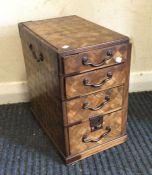 A parquetry four drawer miniature chest. Est. £20