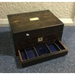 A calamander wood travelling vanity box. Est. £50