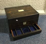 A calamander wood travelling vanity box. Est. £50
