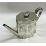 A Victorian silver teapot attractively decorated w