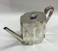 A Victorian silver teapot attractively decorated w