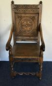 A heavy oak carved hall chair on barley twist supp