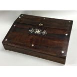 A rosewood and MOP slope top stationery box. Est.