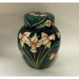 MOORCROFT: A 'Daffodil' pattern ginger jar and cov