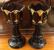 A large pair of ruby glass lustres. Est. £20 - £30