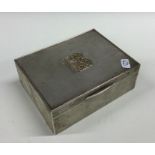 A heavy engine turned silver cigar box, the solid