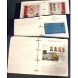 Three folios of first day stamp and coin covers. E