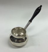 A George II silver brandy pan with turned handle.