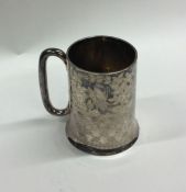 An Edwardian silver christening cup on sweeping ba