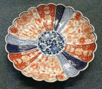 A large Chinese Imari charger decorated in bright